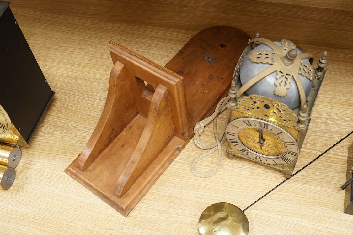 R. Arnold, Bodmin, a lantern clock on wooden wall shelf, clock 32cm high